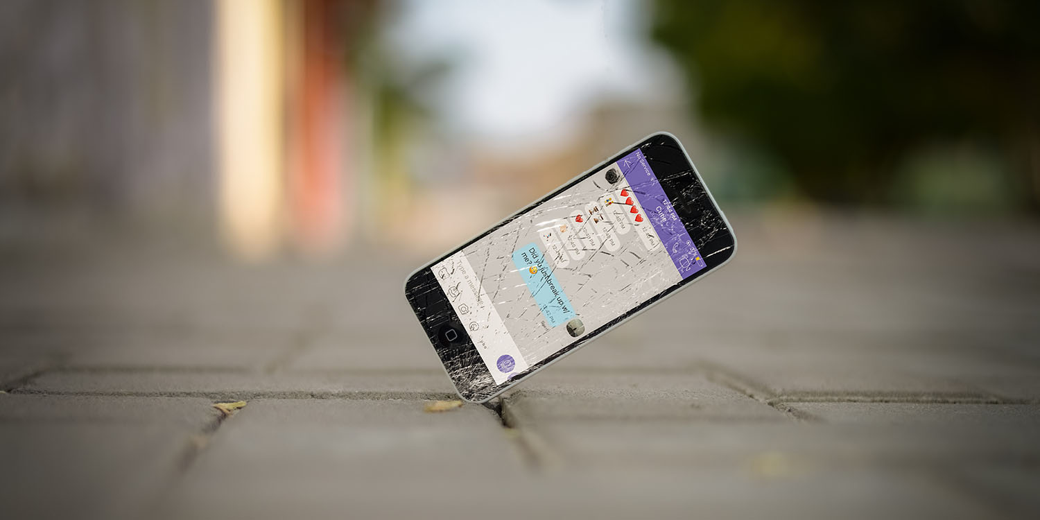 Photo of iPhone with messages being shattered | EU CSAM scanning law could outlaw end-to-end encryption of messages