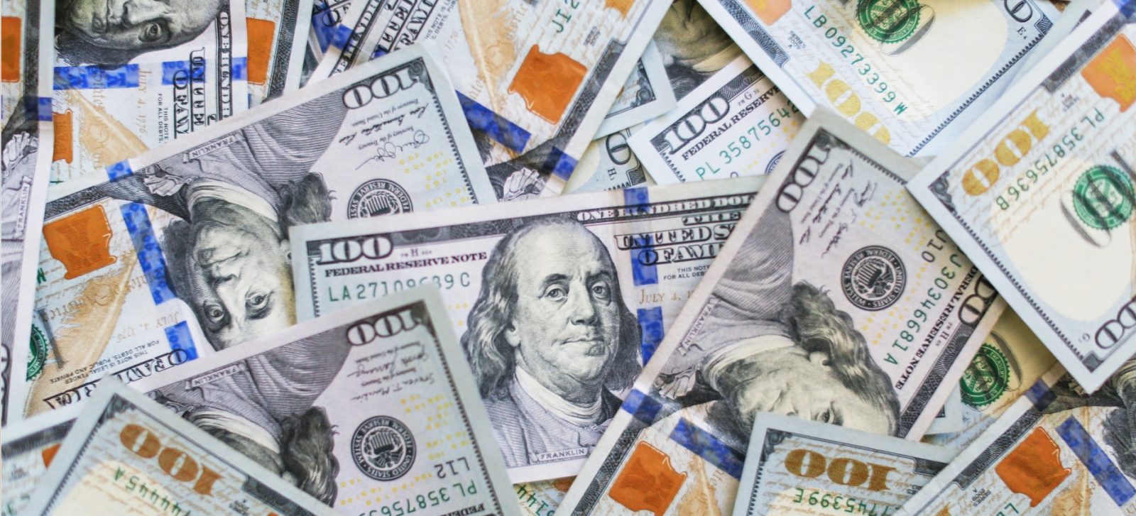 Lots of $100 bills | UK antitrust body will be able to fine Apple and Google billions