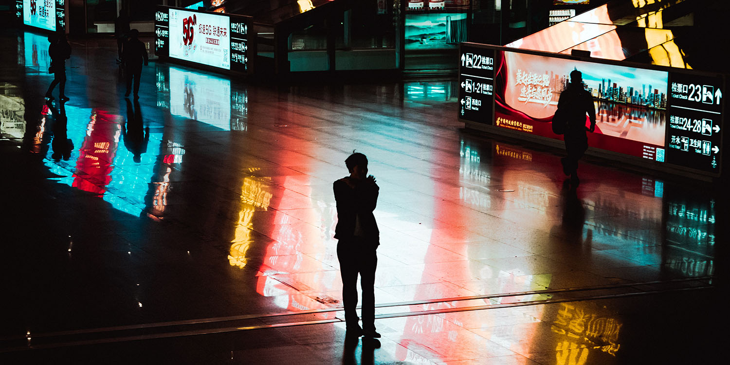 Apple ad business | Abstract image of people looking at colorful ads