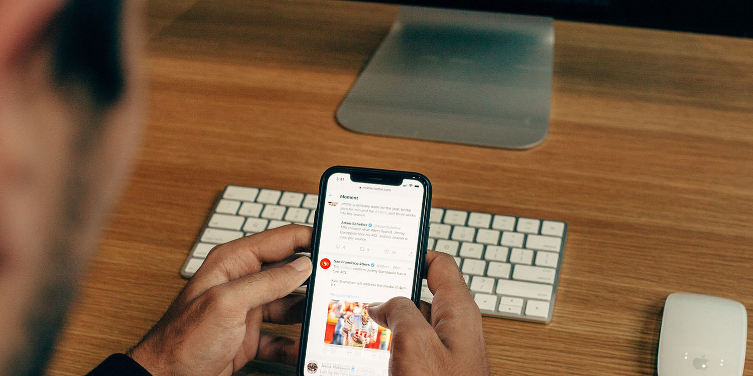 Edit tweets | User browsing Twitter on iPhone
