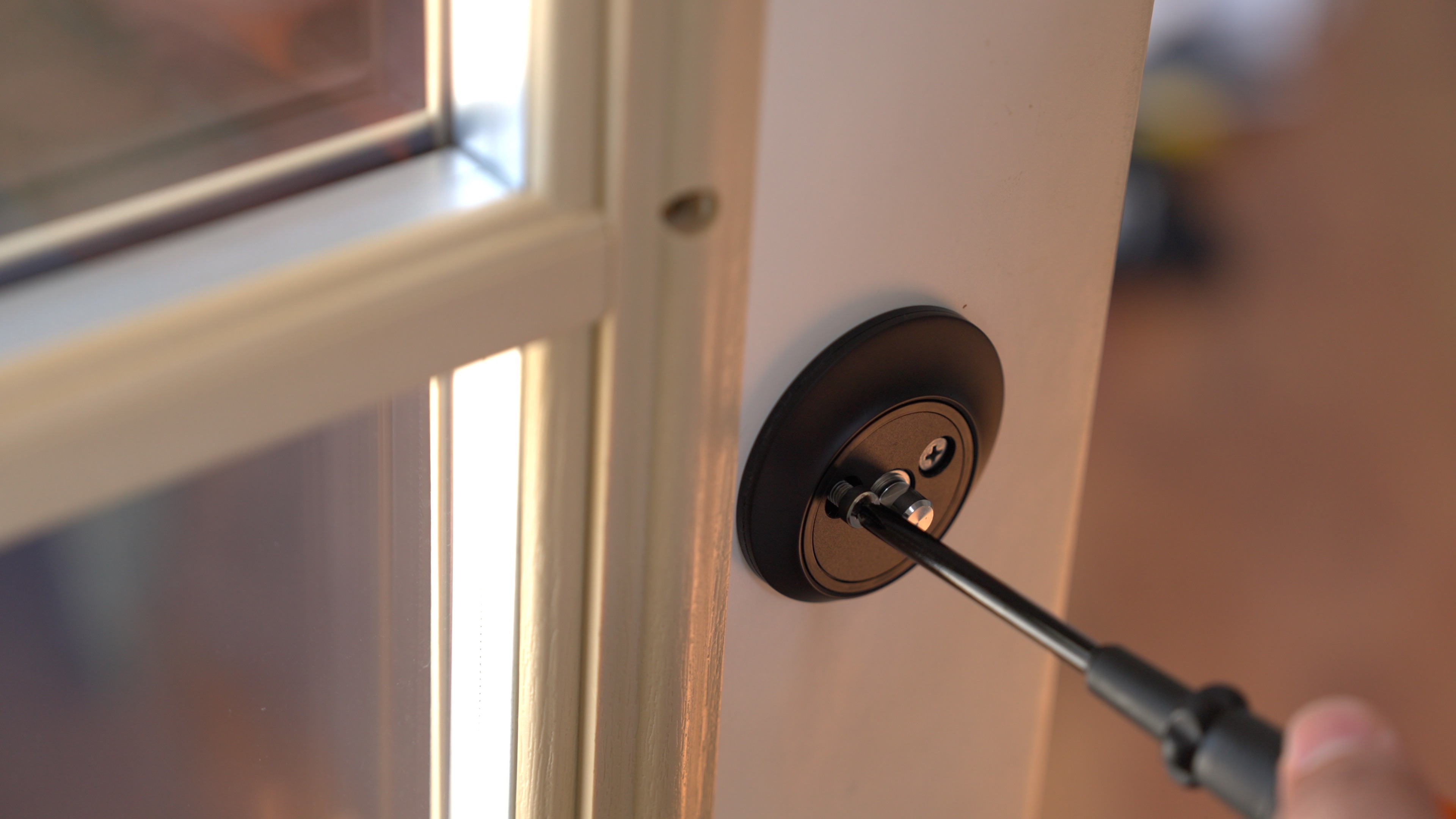 Screwing in Level Lock+ Paddle housing to key housing.