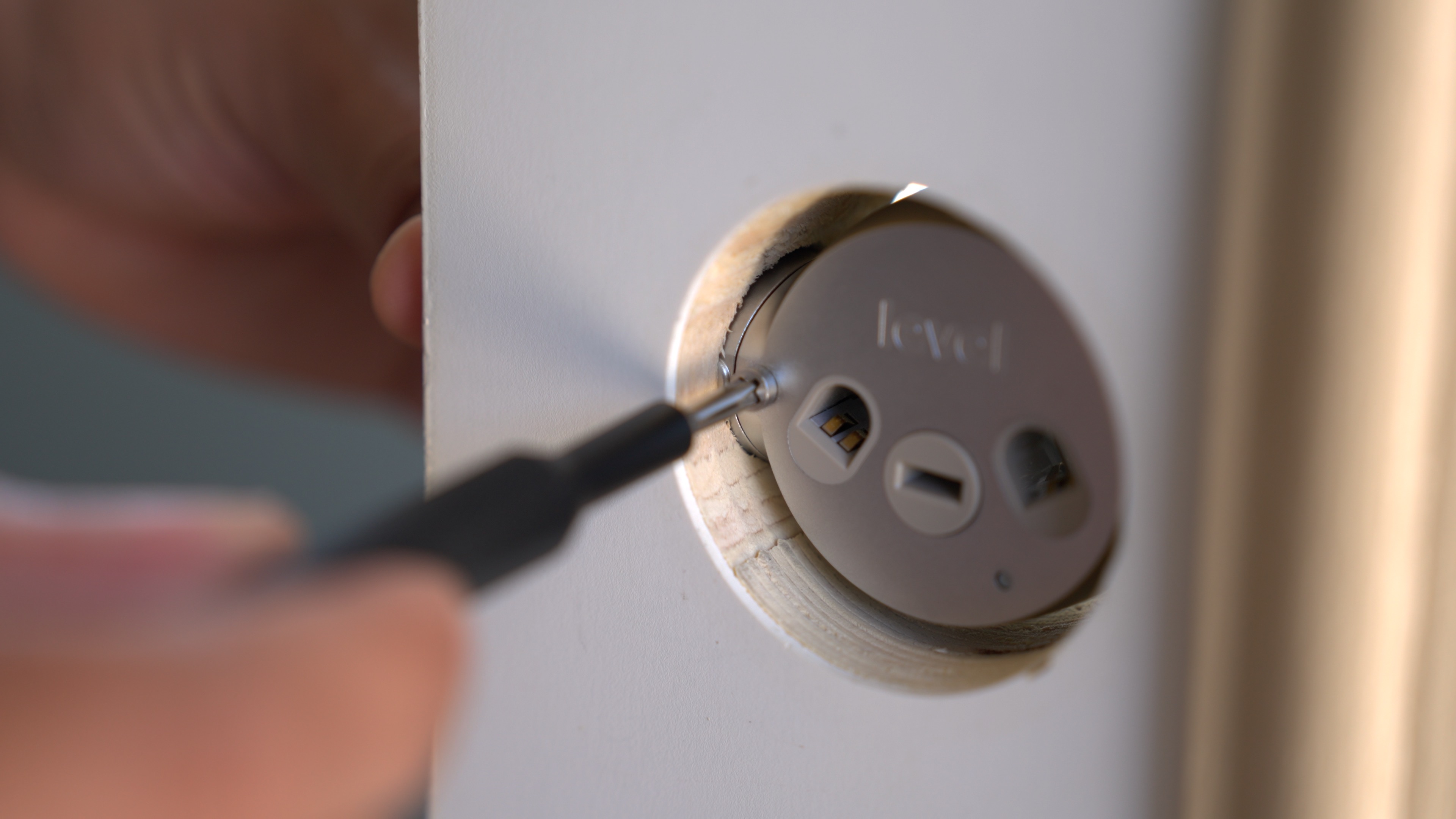 Securing the Level Lock+ motor to the deadbolt.