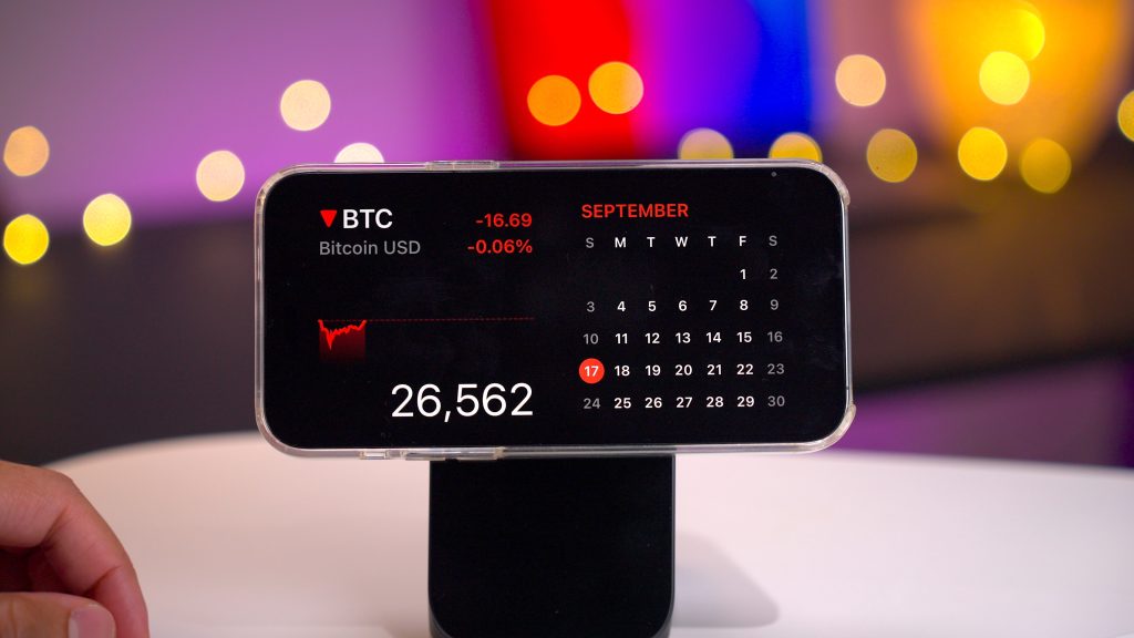 StandBy in iOS 17 showing the Stocks widget and Calendar widget.