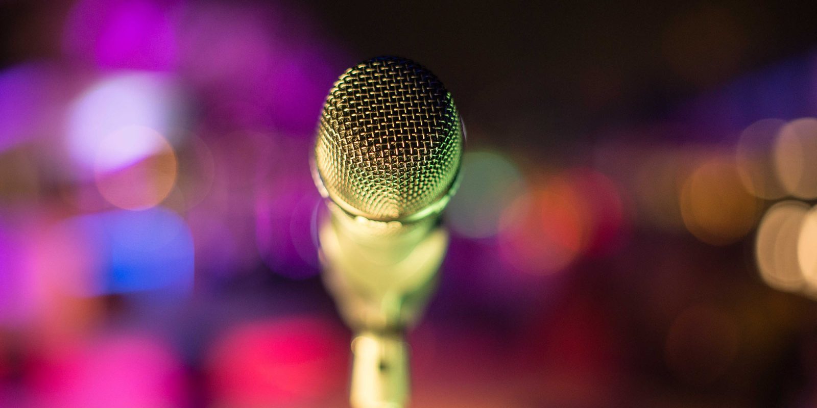 Claims to eavesdrop on your conversations | Microphone against colorful background