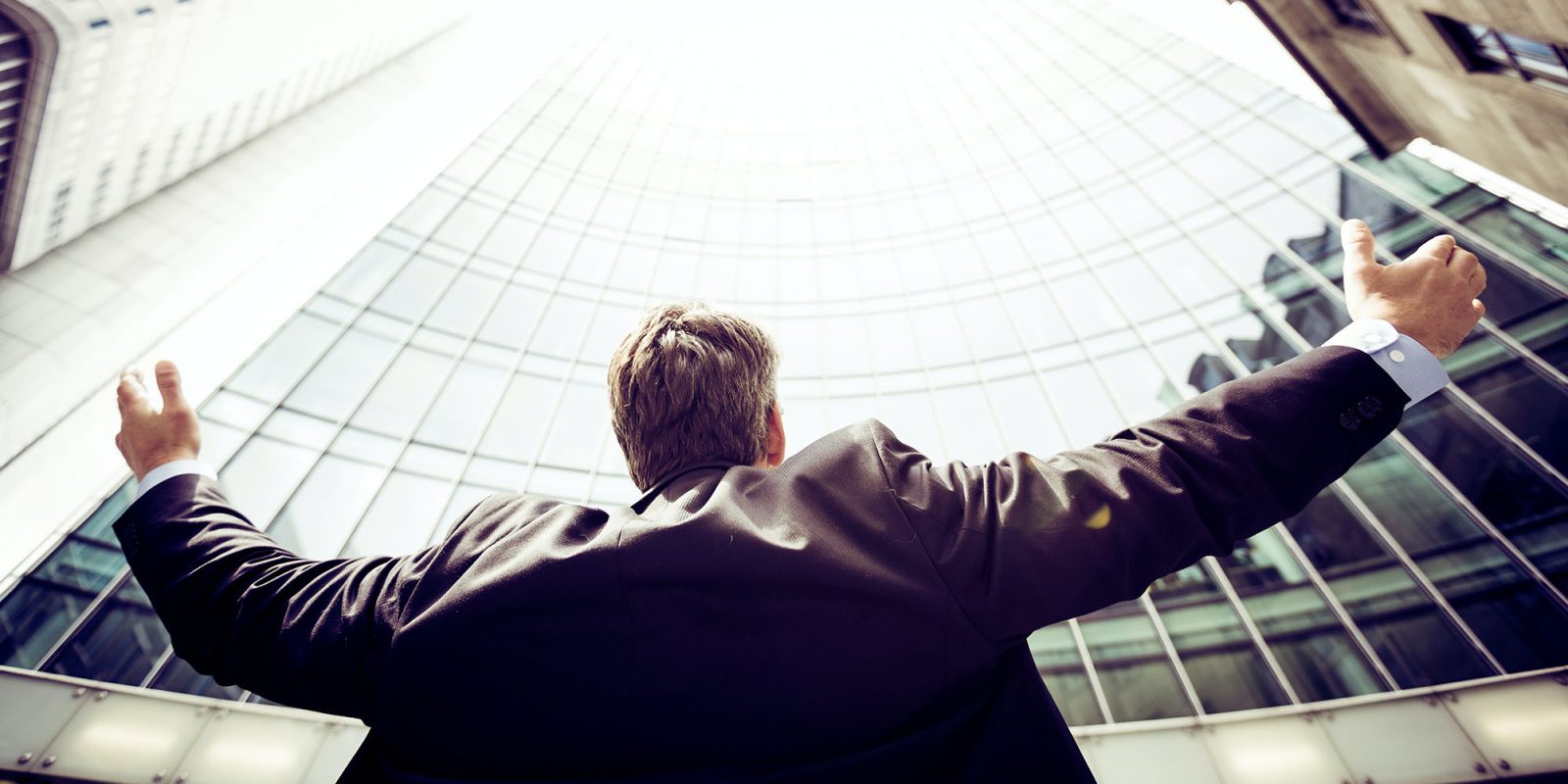 Epic Games victory against Google | Businessman celebrating a win against city backdrop