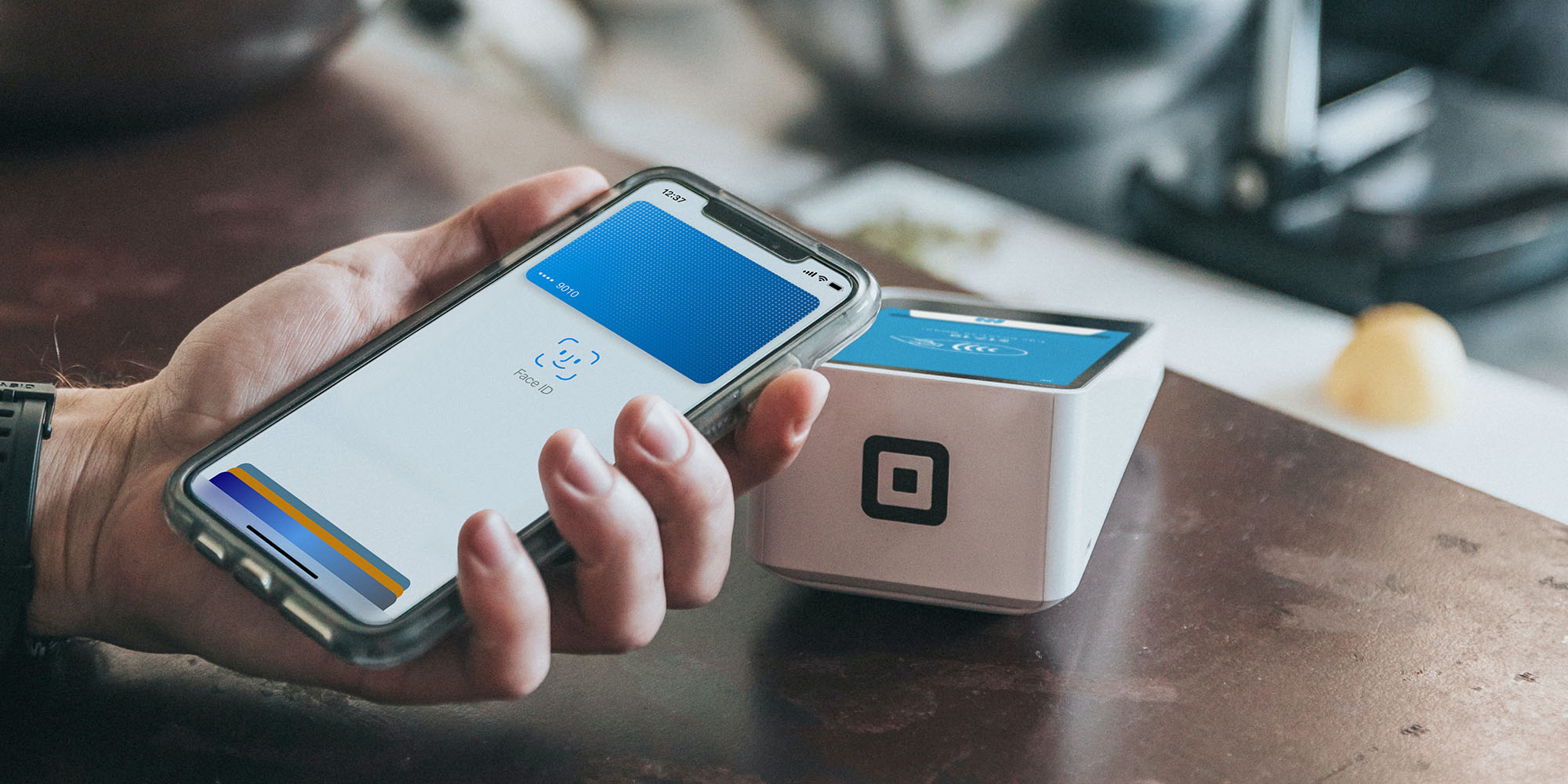 Apple Pay competitor apps coming | iPhone user making mobile wallet payment