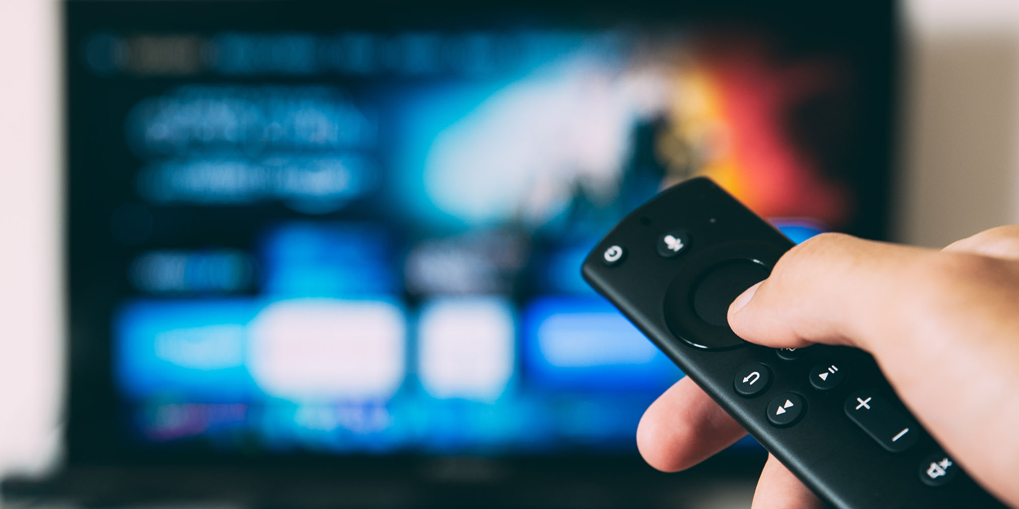 Amazon Prime Video free downgrades | TV remote with out-of-focus TV behind