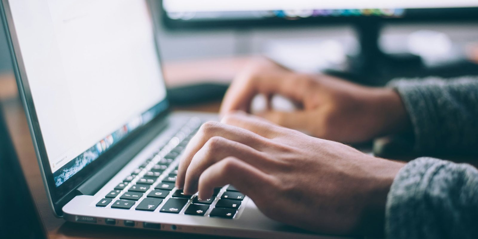 Reddit data-sharing agreement with Cision | Hands typing on MacBook