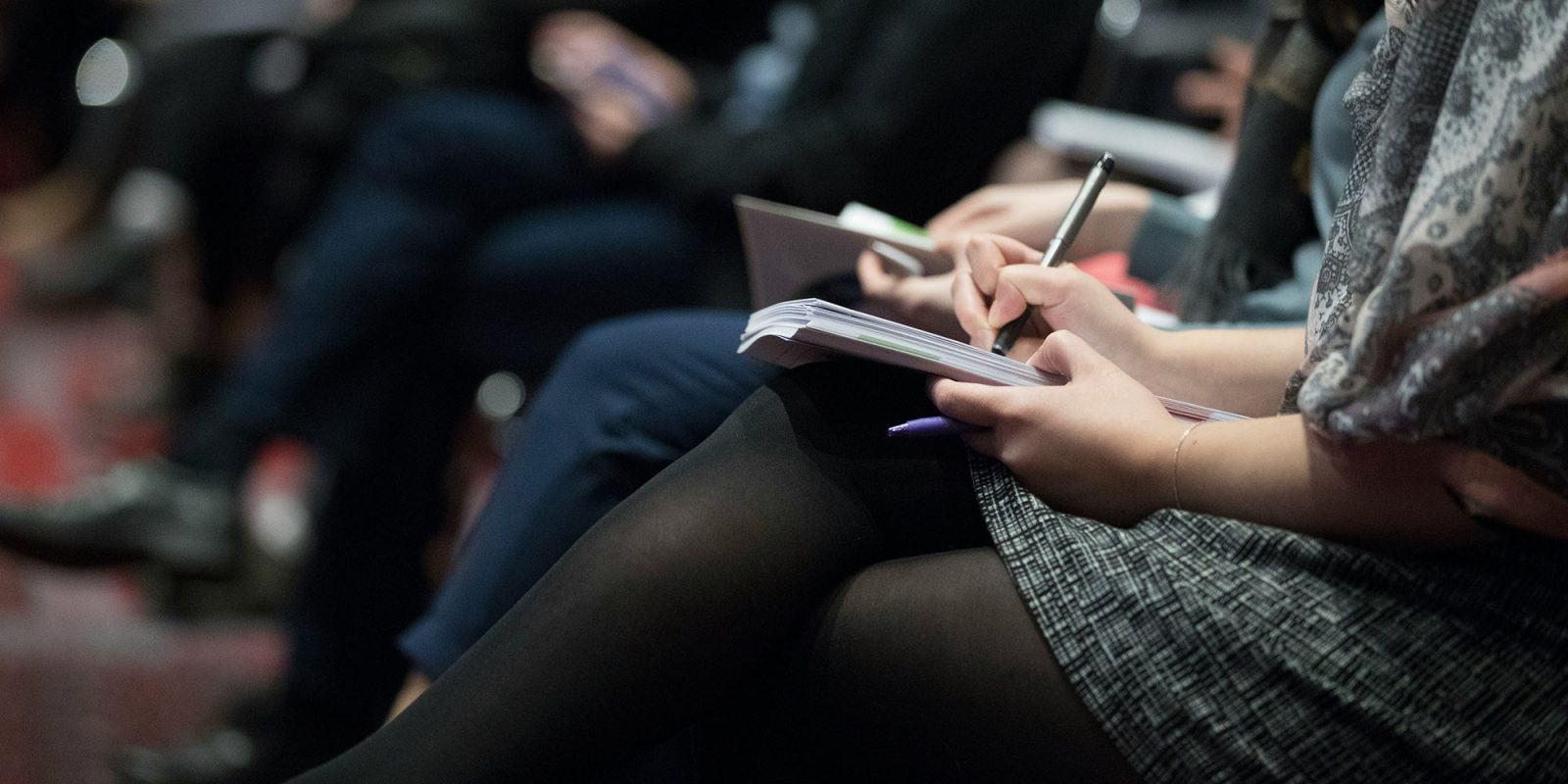 Tim Cook's comments | Woman taking notes