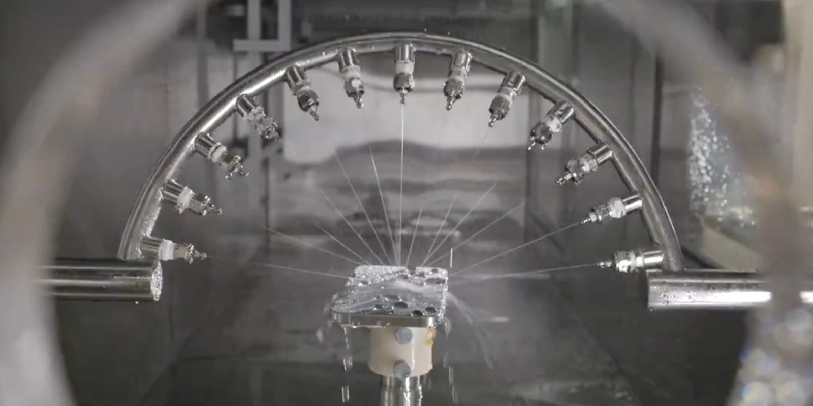 A rare look inside the durability lab where Apple tortures its products | Water jet test shown