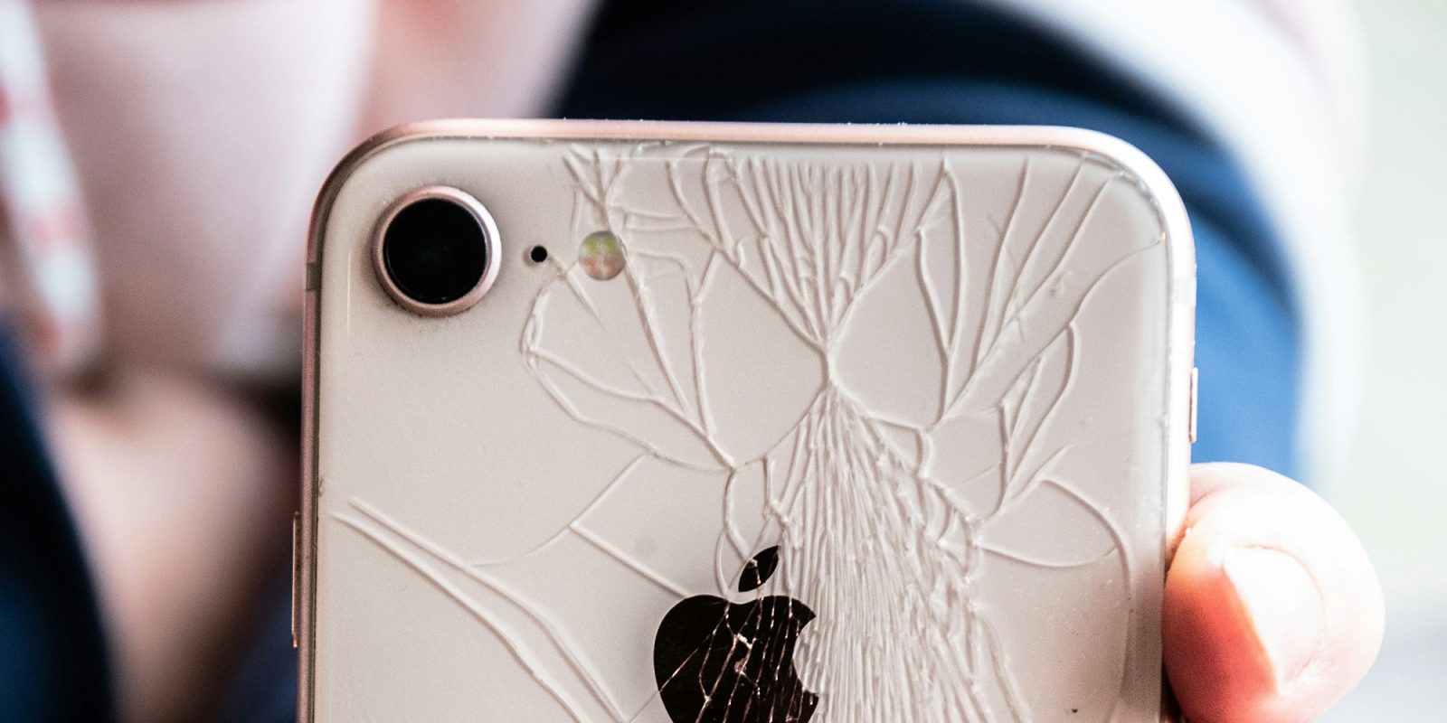 Apple research lab opening focusing on boosting quality and reliability | iPhone with smashed back glass