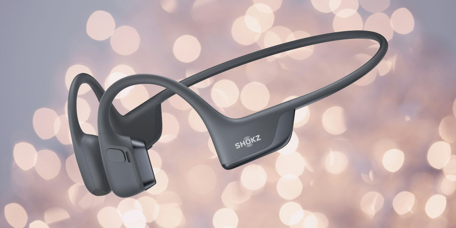 Shokz OpenRun Pro 2 review | Product shot against a blurred fairy light background