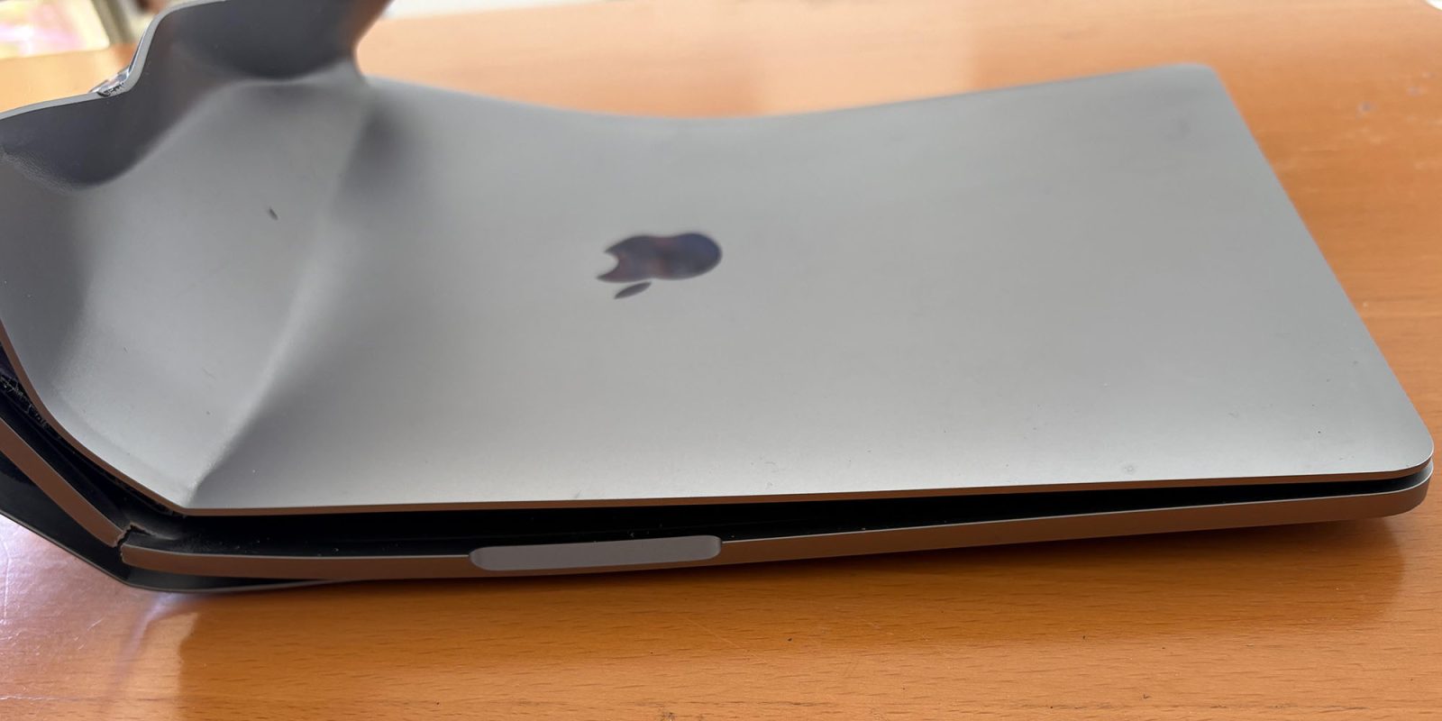 AppleCare+ coverage denied after MacBook Pro destroyed in a car crash (damage shown)