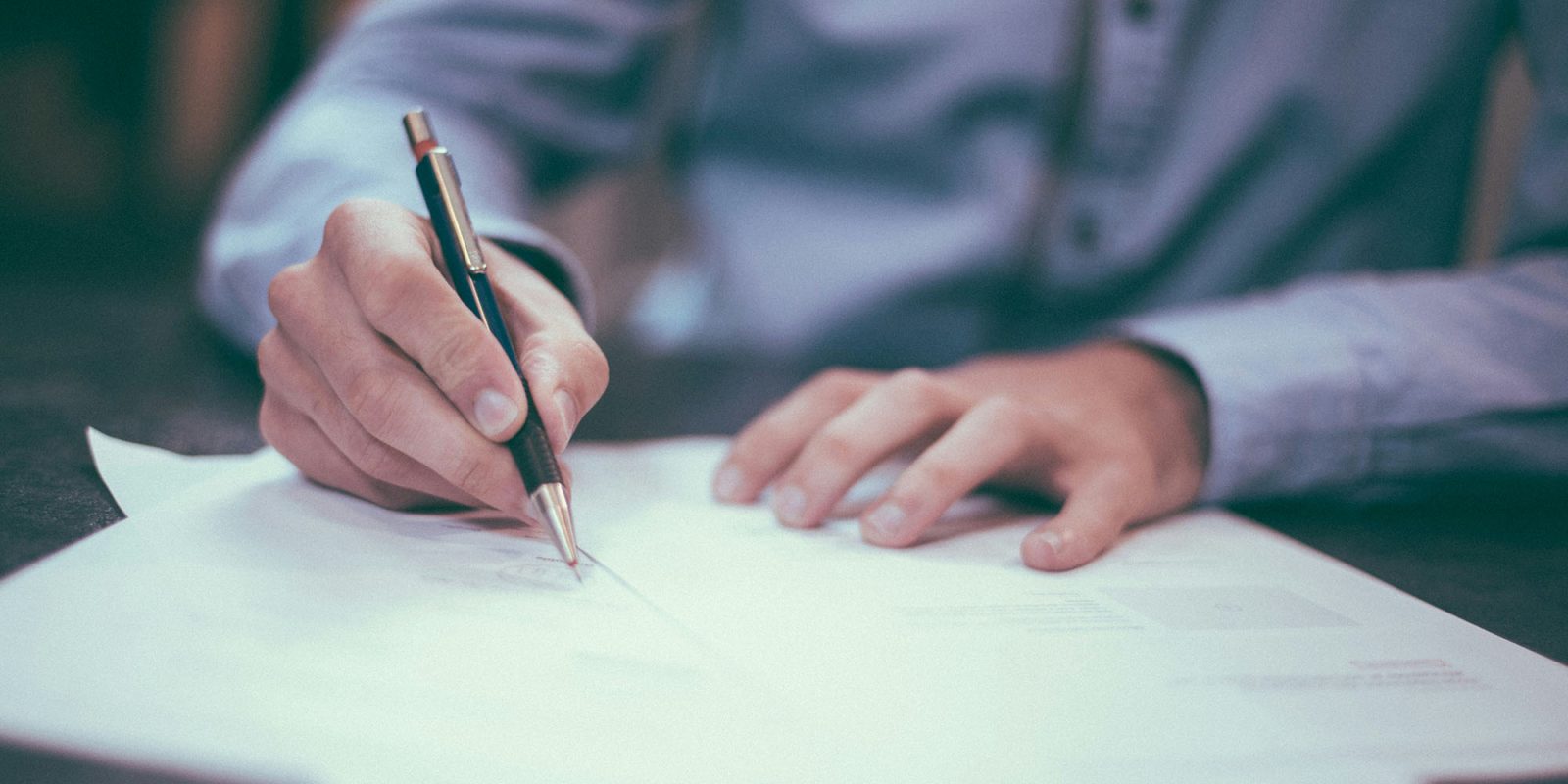 Apple made this change to avoid appearing to approve porn apps | A close-up photo of a man making notes