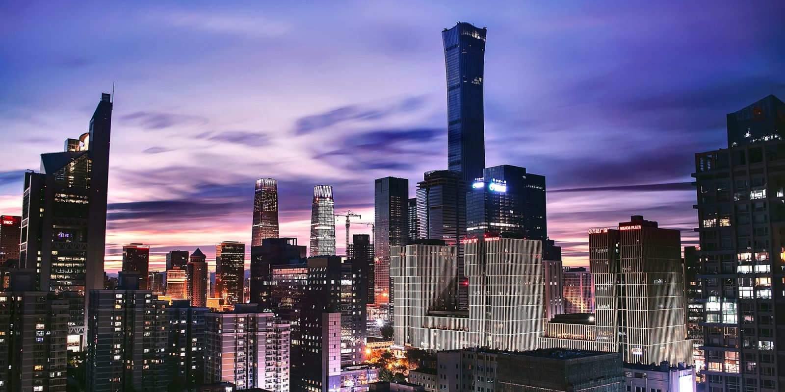 China considering antitrust investigation into Apple, likely as leverage in trade war | Photo shows Beijing skyline at dusk