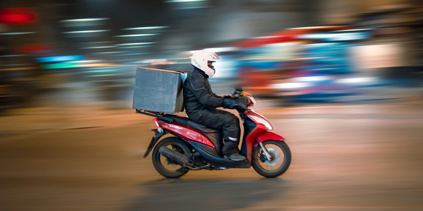 Grubhub security breach exposed customer and driver data | A food delivery rider on a scooter