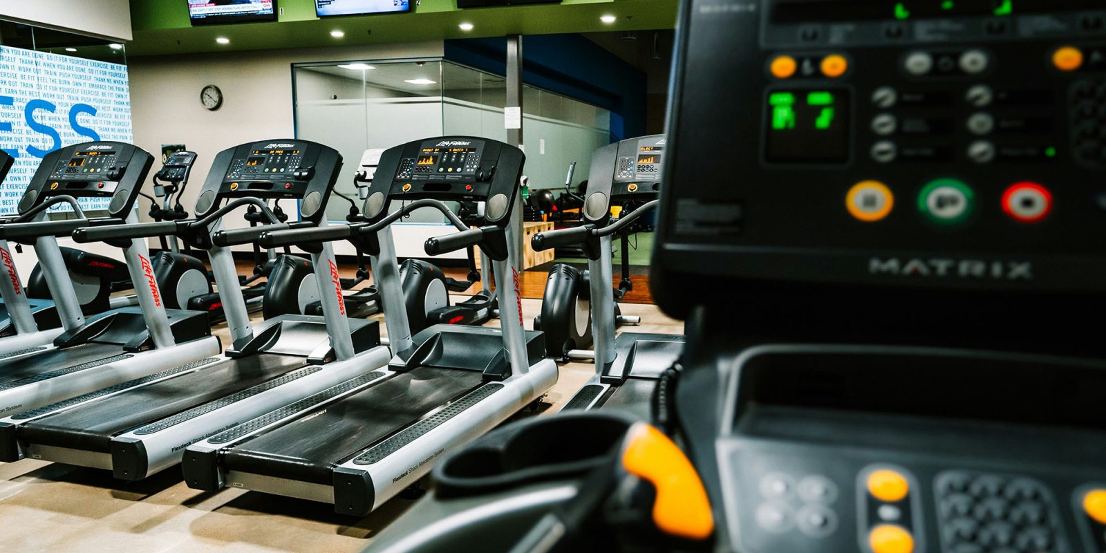 The five reasons some people wear their Apple Watch on their ankle | Stock photo of treadmills in a gym