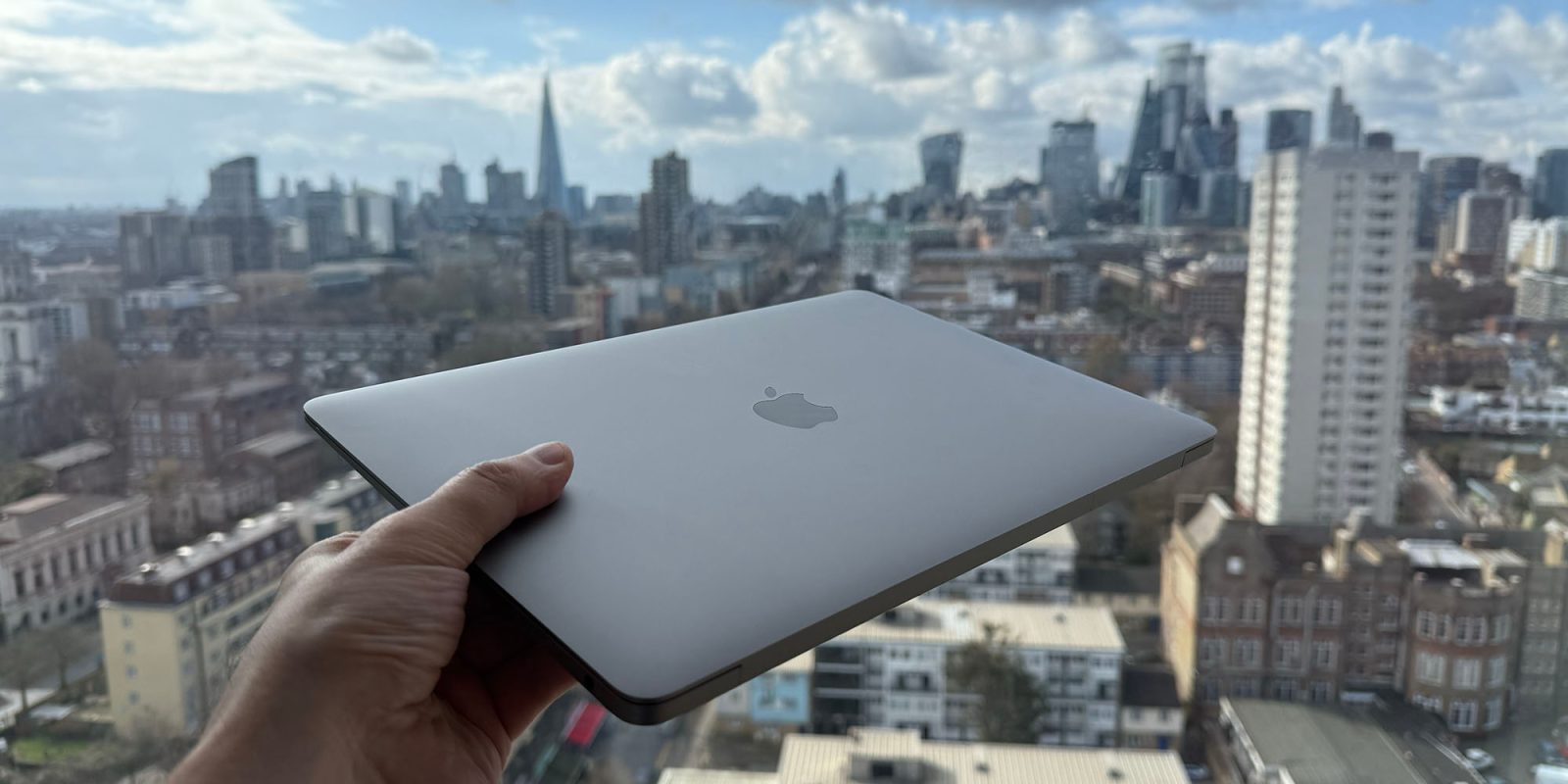 I have absolutely no business buying an M4 MacBook Air, and yet | M1 MacBook Air seen against the London skyline