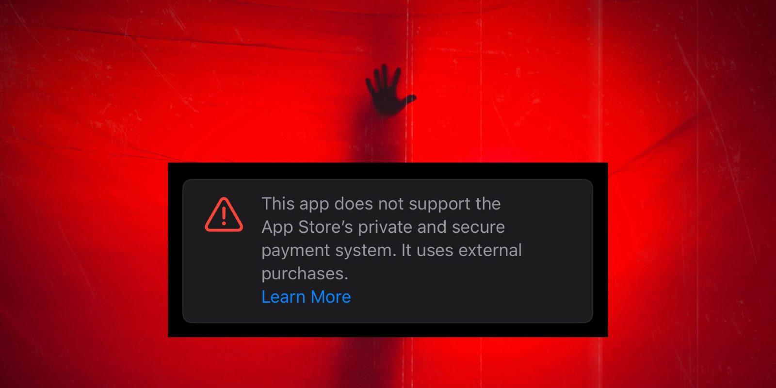 Apple using sketchy warning for apps bought using third-party payment systems | Screengrab against dramatic red background