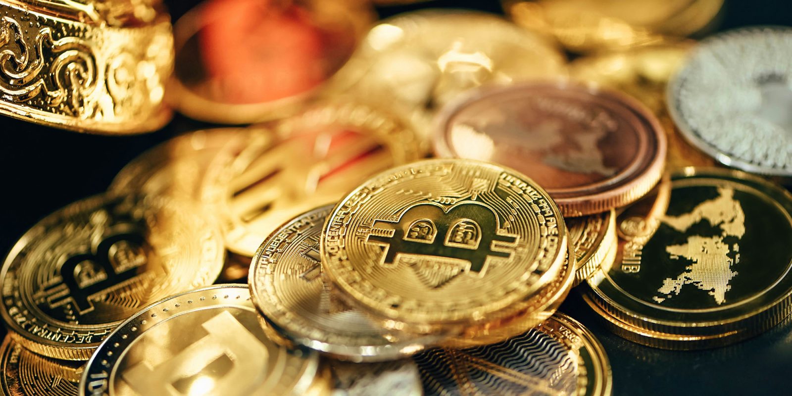 Coinbase hack sees some customers tricked into sending funds; will be reimbursed | Photo of physical representations of cryptocurrency