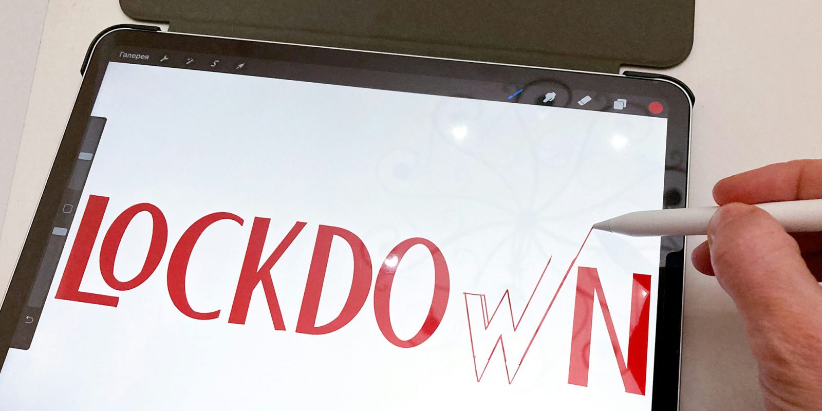 iPad shipments are up this year, and the pandemic is a key reason | Someone writing 'Lockdown' on an iPad