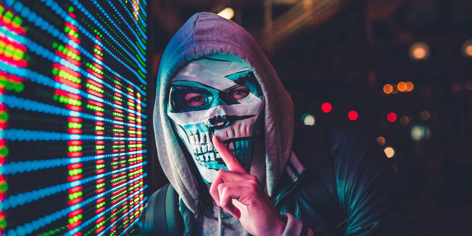 China covertly using ChatGPT for propaganda posts on social media, says OpenAI \ Masked man next to digital sign makes ssshh gesture