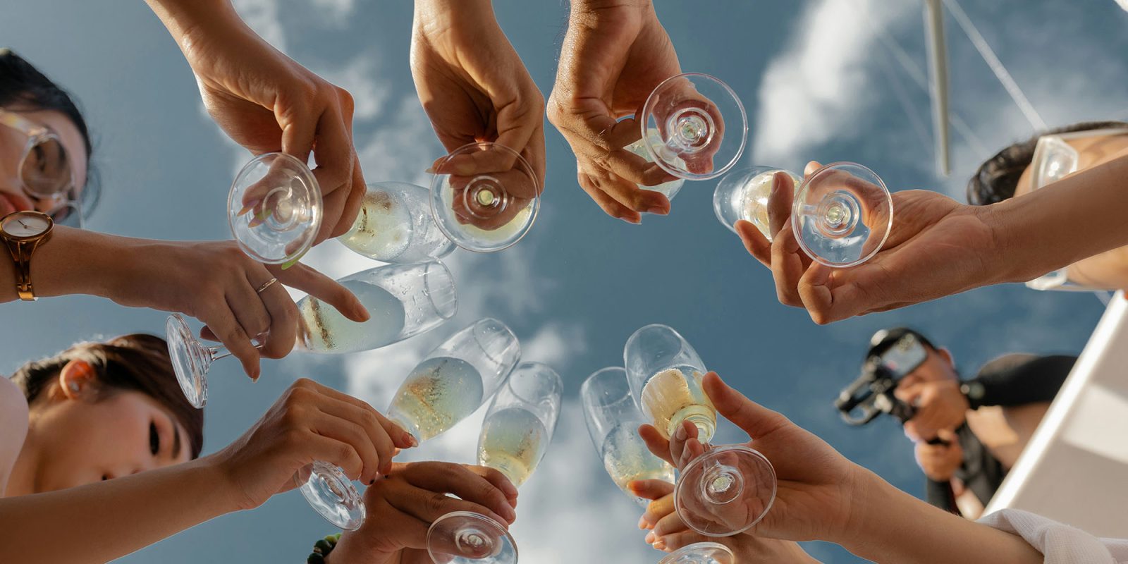 Apple should make these three changes to the Find My app | A group of friends toasting with champagne