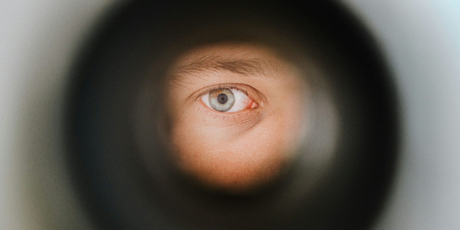 Meta bypassed Apple privacy protections, and fired employee who flagged it – FT | Photo of an eye looking through a spy-hole