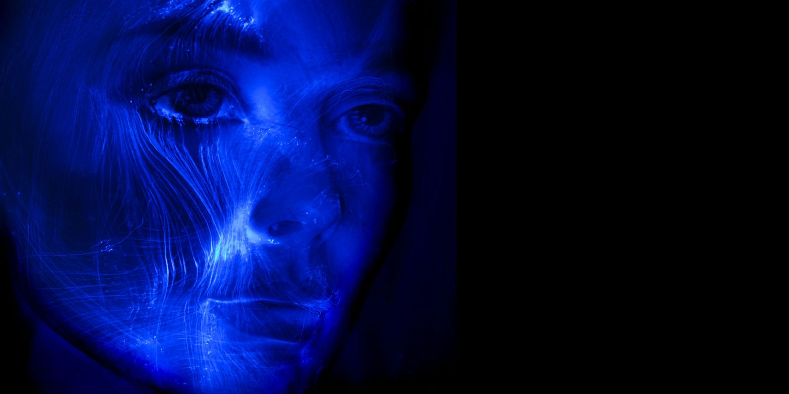 Apple co-founder Steve Wozniak supports an interim ban on AI superintelligence | Futuristic-looking light painting of a woman's face