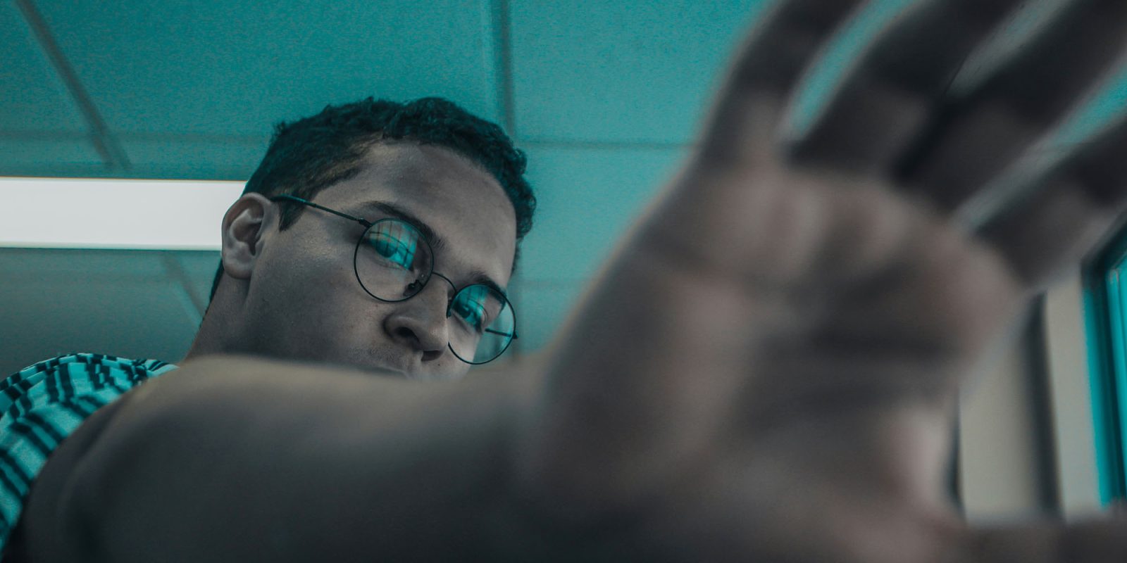 Apple faces cybercrime investigation in France after Siri complaint | Stock photo of a man using a blocking gesture