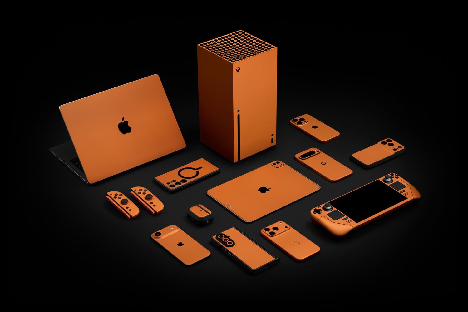 Now you can have all your Apple devices in the new Cosmic Orange | Dbrand skins shown