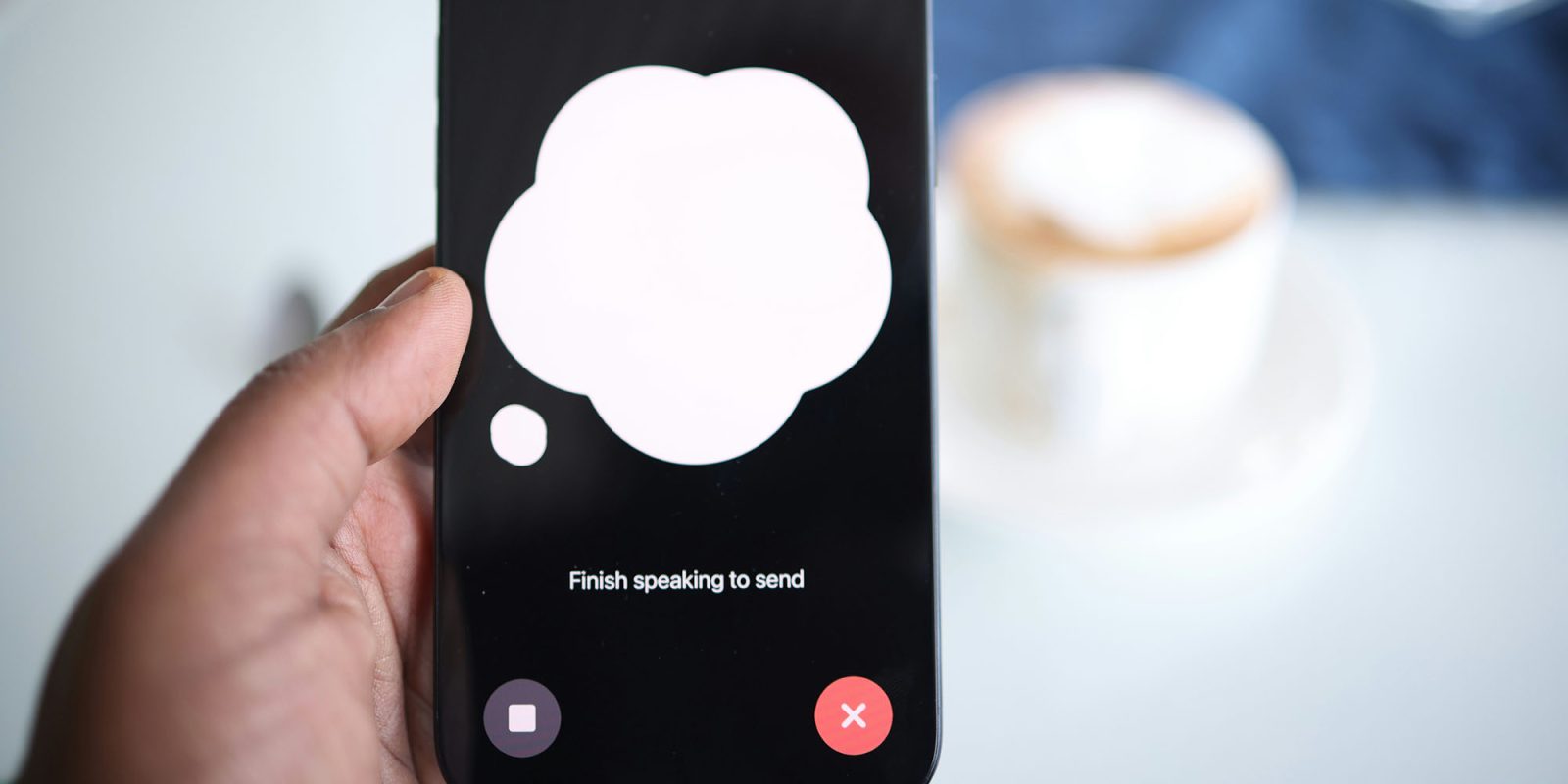 ChatGPT ads are on the way, but iPhone users can avoid them | A close-up of an iPhone user speaking to ChatGPT