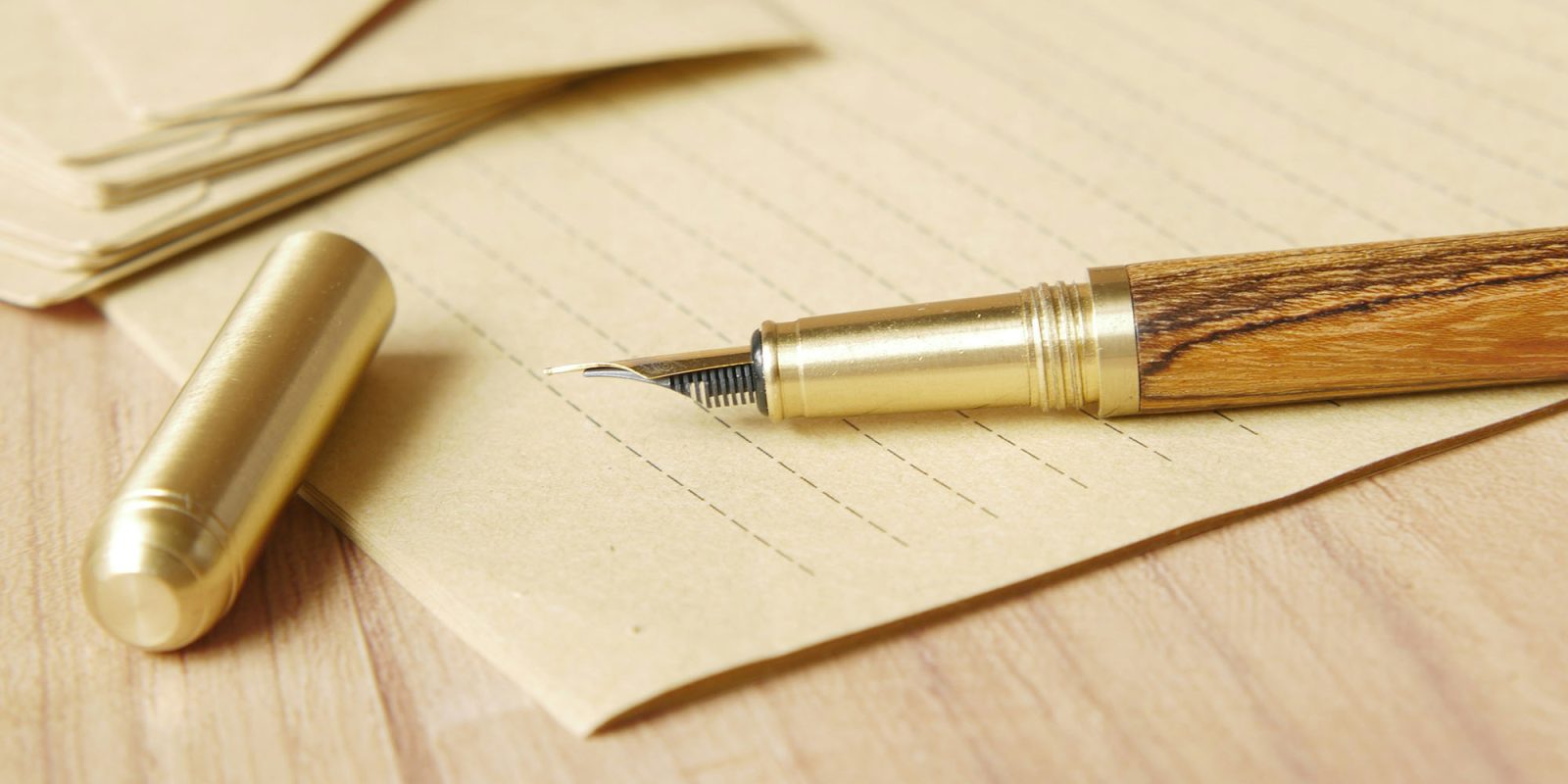 As confusion reigns over Jony Ive's iO device, I remain an AI hardware skeptic | Image shows a beautiful-looking fountain pen in wood and brass