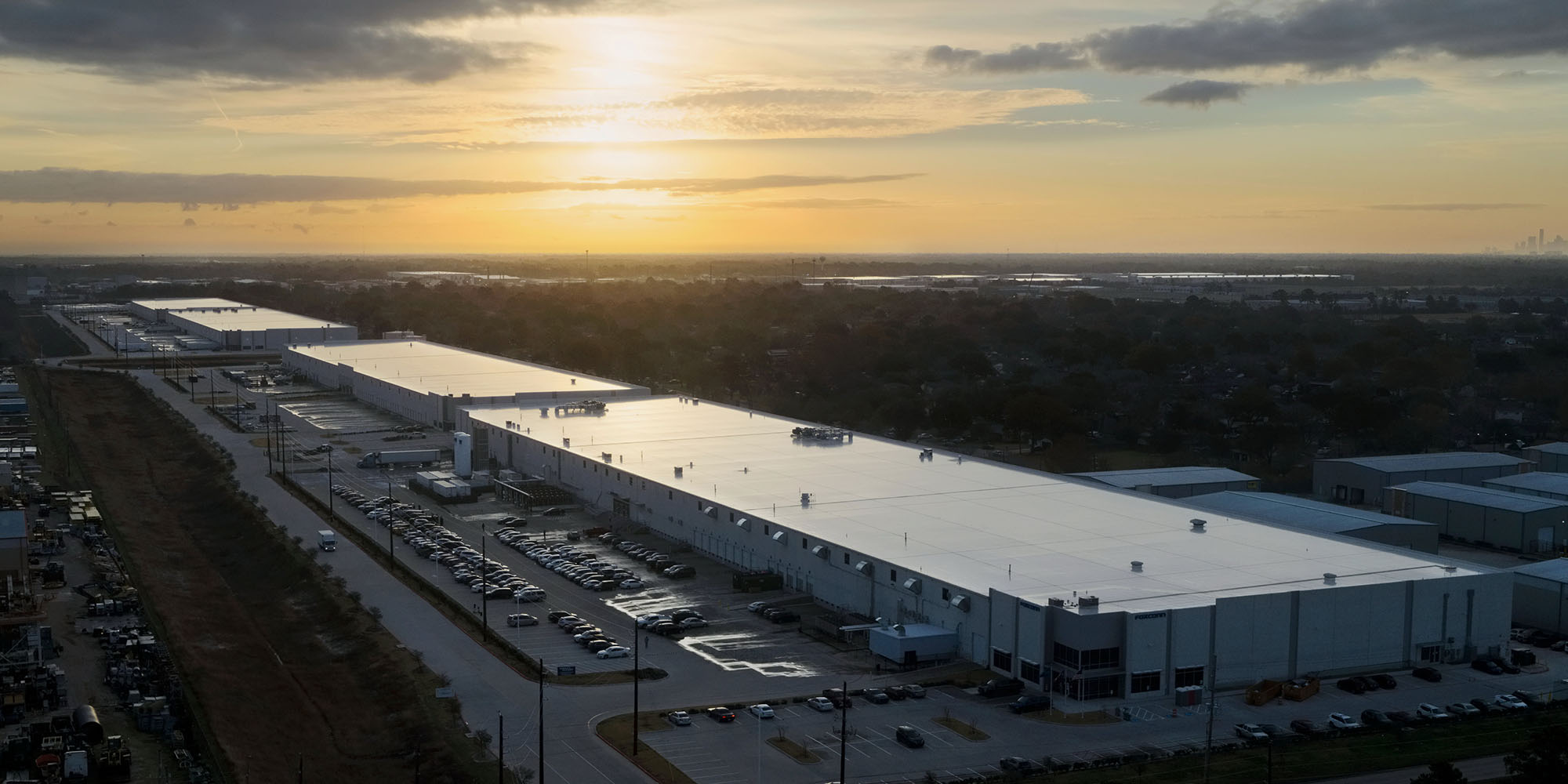 Apple shares more details, photos, and video of US Mac mini plant | Photo shows an aerial view of the plant at sunset
