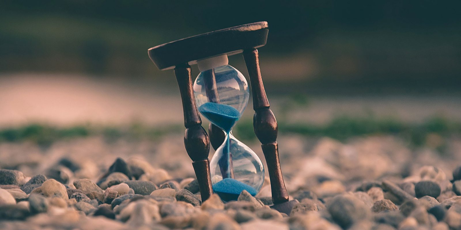 iCloud really needs to copy Dropbox 'sync next' | Photo of an hourglass with blue sand